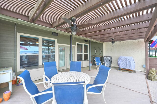 102 Capetown Slip, Conroe, TX 77356 - view of patio / terrace with a ceiling fan, a wooden deck, outdoor dining area, and a pergola