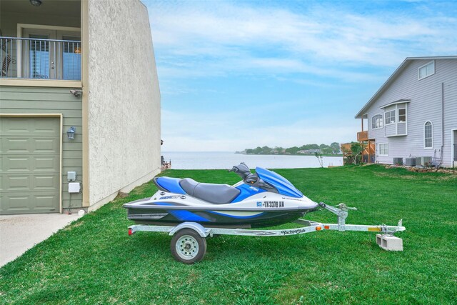 102 Capetown Slip, Conroe, TX 77356 - view of grassy yard featuring a water view