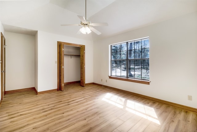 110 Dickens Landing Dr, Livingston, TX 77351 - unfurnished bedroom featuring ceiling fan, baseboards, lofted ceiling, light wood-type flooring, and a closet