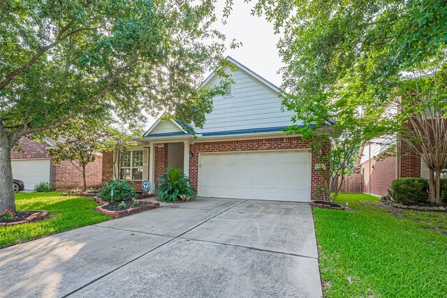 2610 Golden Creek Ln, Pearland, TX 77584 - view of front of house featuring brick siding, driveway, and a garage
