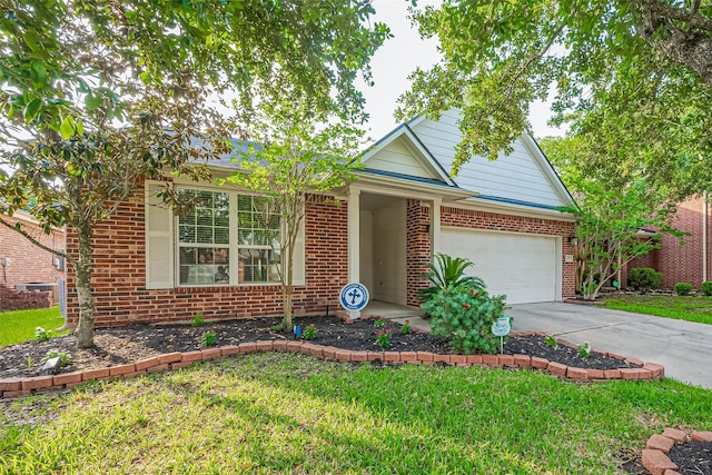 2610 Golden Creek Ln, Pearland, TX 77584 - view of front of home featuring brick siding, concrete driveway, an attached garage, and a front lawn