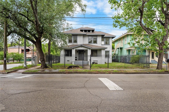 720 W Alabama St, Houston, TX 77006 - traditional style home featuring stucco siding, a shingled roof, and a fenced front yard