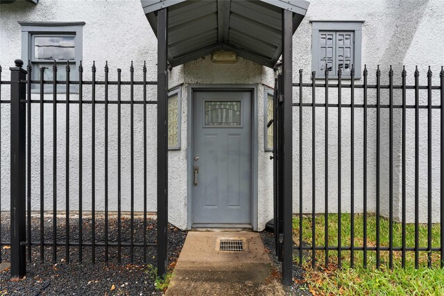 720 W Alabama St, Houston, TX 77006 - property entrance featuring a gate and stucco siding