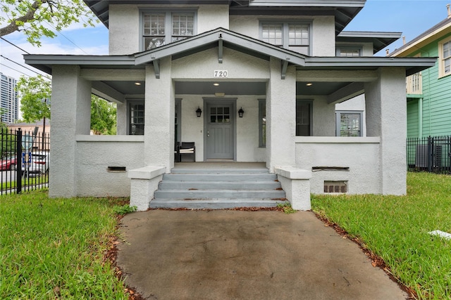 720 W Alabama St, Houston, TX 77006 - view of front of house featuring stucco siding and a porch