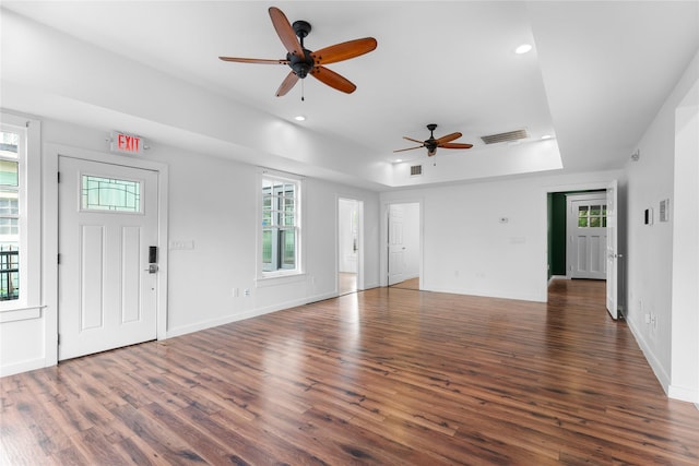 720 W Alabama St, Houston, TX 77006 - unfurnished living room featuring a tray ceiling, wood finished floors, ceiling fan, and recessed lighting