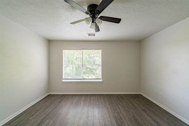 unfurnished room with dark wood finished floors, visible vents, a textured ceiling, and ceiling fan