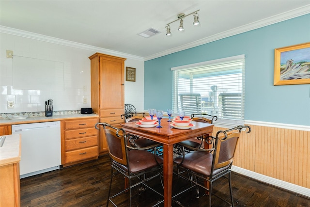 4025 6th St, Galveston, TX 77554 - dining room with visible vents, crown molding, dark wood-style floors, and wainscoting