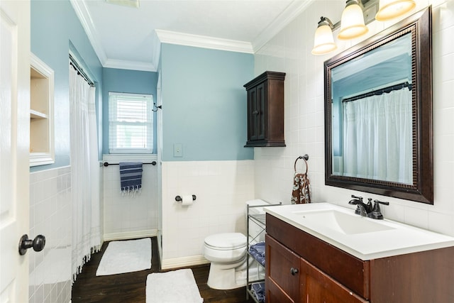 4025 6th St, Galveston, TX 77554 - full bath featuring crown molding, wood finished floors, vanity, tile walls, and toilet