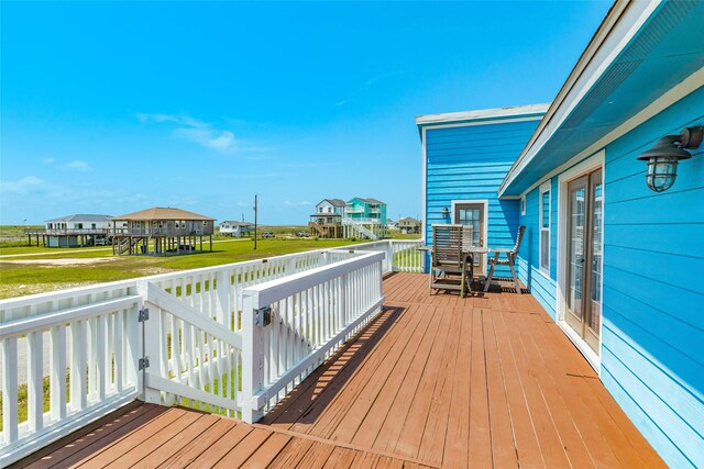 4025 6th St, Galveston, TX 77554 - wooden deck with a residential view