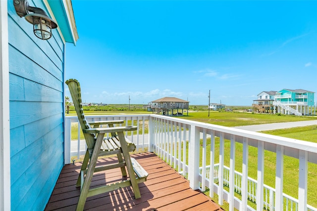 4025 6th St, Galveston, TX 77554 - wooden deck with a yard