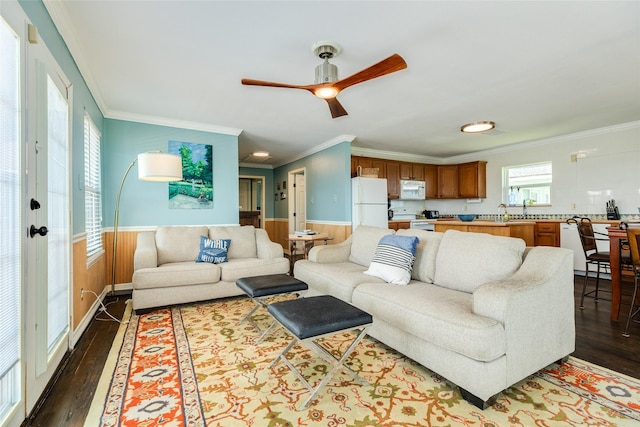 4025 6th St, Galveston, TX 77554 - living area featuring ceiling fan, dark wood-type flooring, and ornamental molding