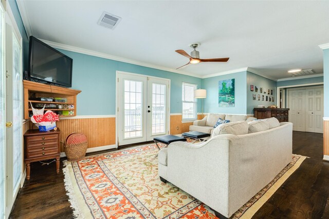 4025 6th St, Galveston, TX 77554 - living area featuring wood finished floors, visible vents, a ceiling fan, ornamental molding, and wainscoting