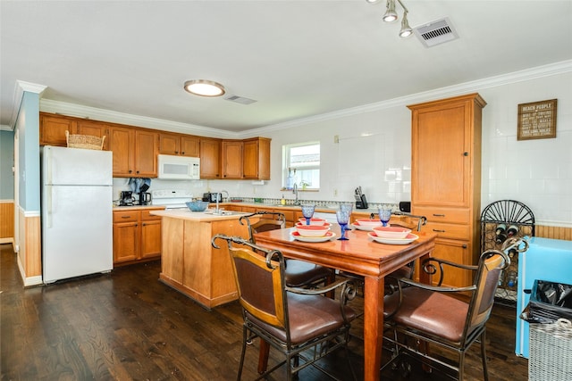 4025 6th St, Galveston, TX 77554 - kitchen featuring dark wood finished floors, ornamental molding, white appliances, and light countertops