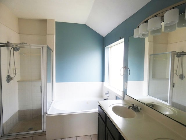 3015 Davey Oaks St, Pearland, TX 77584 - full bathroom featuring a stall shower, a bath, double vanity, tile patterned floors, and vaulted ceiling