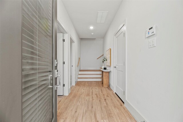 1044 Homer St, Houston, TX 77091 - hall with light wood-style flooring, stairway, recessed lighting, and baseboards
