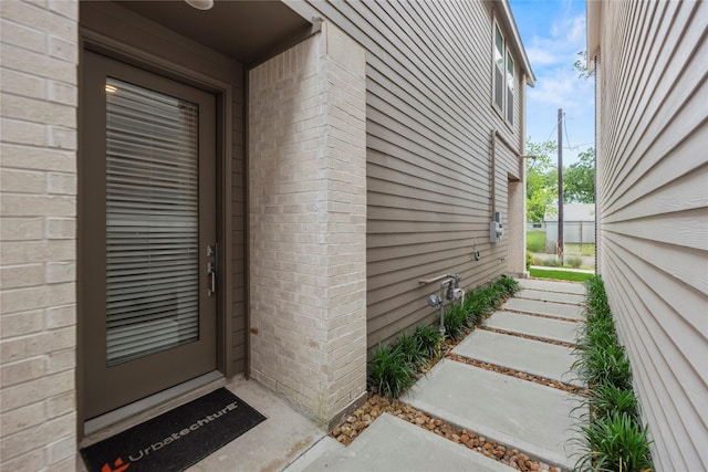 1044 Homer St, Houston, TX 77091 - doorway to property with brick siding