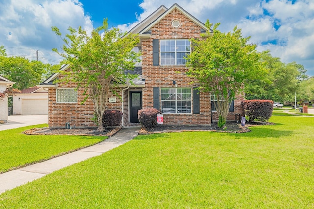 view of front facade featuring driveway, a front lawn, brick siding, and a garage