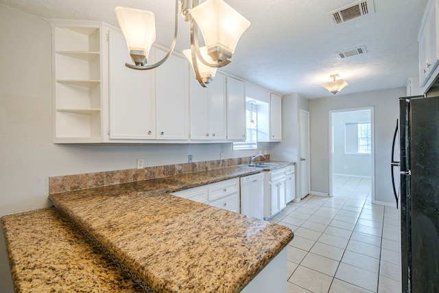 5023 Glendower Dr, Spring, TX 77373 - kitchen featuring a sink, visible vents, freestanding refrigerator, and dishwasher