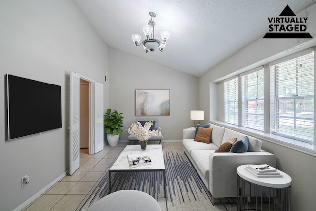 5023 Glendower Dr, Spring, TX 77373 - living area featuring baseboards, light tile patterned floors, a chandelier, and vaulted ceiling