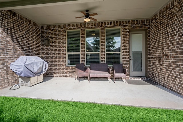 view of patio / terrace with grilling area and ceiling fan