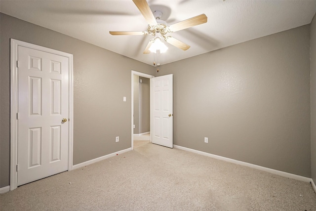 10314 Friars Hl, Houston, TX 77070 - unfurnished bedroom featuring ceiling fan, baseboards, and light colored carpet