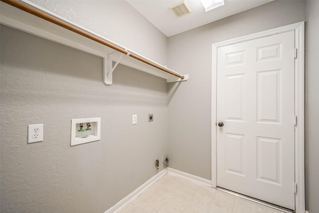 10314 Friars Hl, Houston, TX 77070 - clothes washing area with baseboards, visible vents, hookup for a washing machine, electric dryer hookup, and laundry area