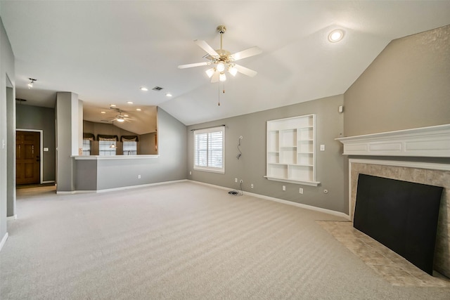 10314 Friars Hl, Houston, TX 77070 - unfurnished living room with lofted ceiling, light carpet, baseboards, built in shelves, and ceiling fan