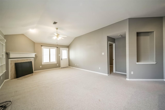 10314 Friars Hl, Houston, TX 77070 - unfurnished living room with a ceiling fan, light carpet, a tiled fireplace, baseboards, and visible vents