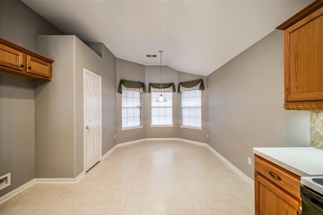 10314 Friars Hl, Houston, TX 77070 - unfurnished dining area with light floors, vaulted ceiling, visible vents, and baseboards