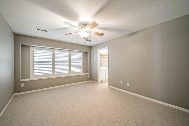 10314 Friars Hl, Houston, TX 77070 - unfurnished room with light carpet, a ceiling fan, visible vents, and baseboards