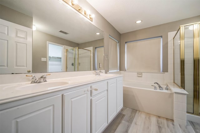 10314 Friars Hl, Houston, TX 77070 - bathroom with a bath, visible vents, a sink, and a shower stall