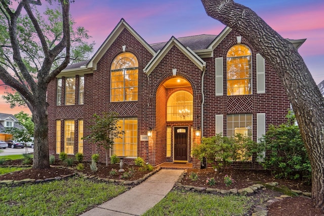 view of front of house with brick siding