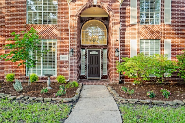 property entrance with brick siding