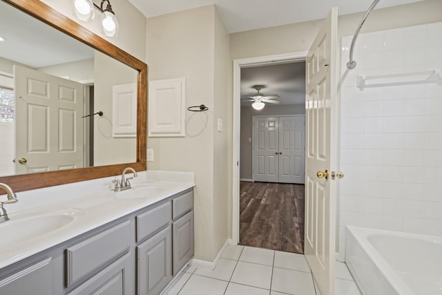 full bath featuring a ceiling fan, tile patterned floors, a sink, and double vanity