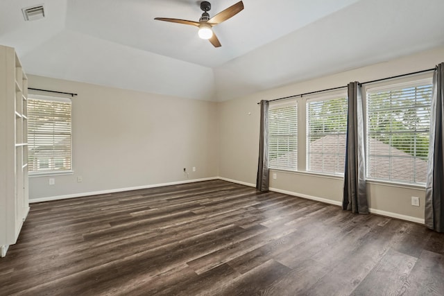 empty room featuring visible vents, baseboards, ceiling fan, and dark wood finished floors