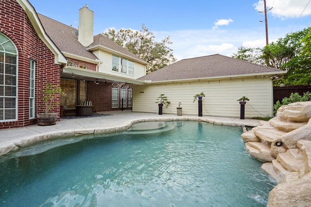 view of swimming pool featuring a fenced in pool, a patio area, and fence