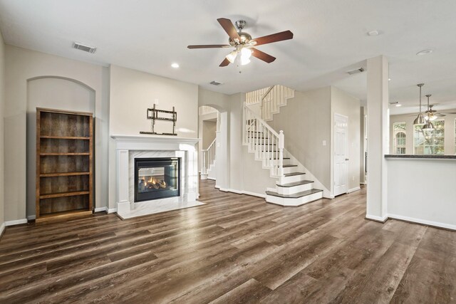 unfurnished living room featuring baseboards, visible vents, recessed lighting, wood finished floors, and ceiling fan