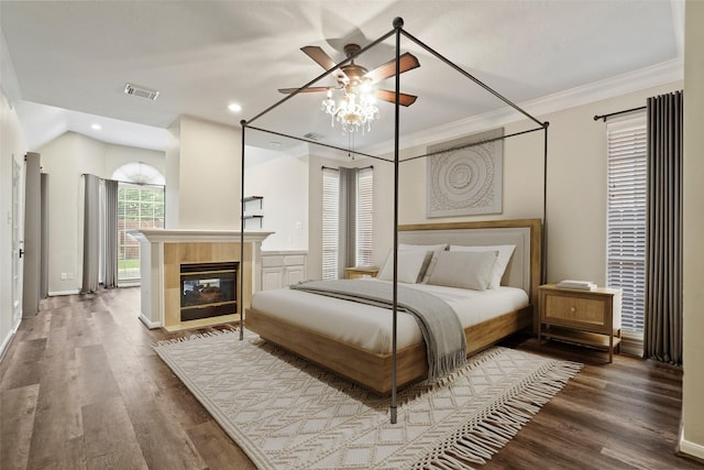 24126 Falcon Point Dr, Katy, TX 77494 - bedroom featuring wood finished floors, recessed lighting, ornamental molding, baseboards, and a tiled fireplace
