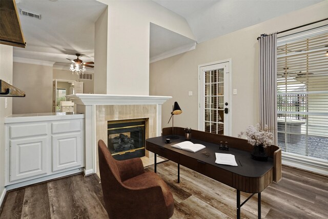 24126 Falcon Point Dr, Katy, TX 77494 - living room featuring dark wood-type flooring, a ceiling fan, a tile fireplace, crown molding, and vaulted ceiling