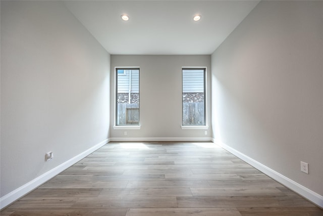 809 Coronado Terrace Ln, Katy, TX 77493 - empty room featuring baseboards, recessed lighting, and wood finished floors