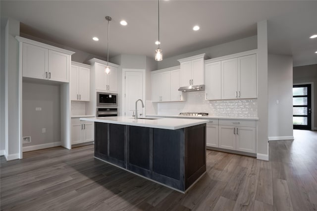 809 Coronado Terrace Ln, Katy, TX 77493 - kitchen featuring a sink, appliances with stainless steel finishes, tasteful backsplash, white cabinets, and baseboards