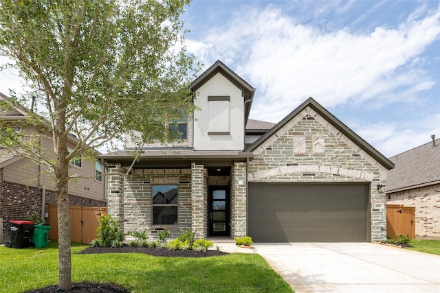 809 Coronado Terrace Ln, Katy, TX 77493 - view of front of home featuring driveway, stone siding, an attached garage, and stucco siding
