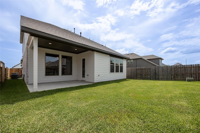 809 Coronado Terrace Ln, Katy, TX 77493 - back of house featuring a patio, central AC, and a shingled roof