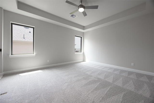 809 Coronado Terrace Ln, Katy, TX 77493 - empty room with baseboards, carpet floors, a ceiling fan, and a tray ceiling