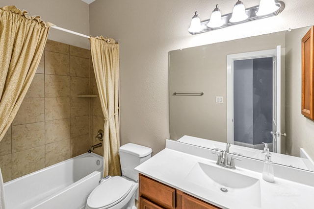 bathroom featuring shower / tub combo with curtain, vanity, and toilet