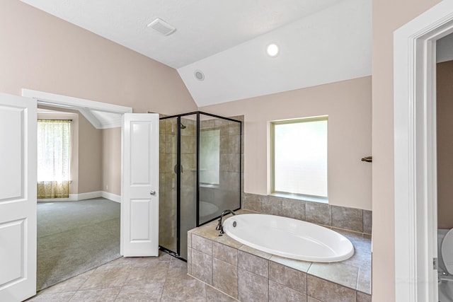 full bathroom featuring a shower stall, lofted ceiling, a bath, and visible vents