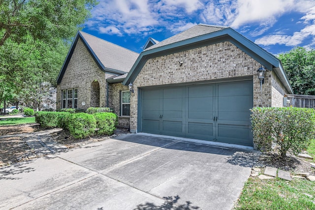 12510 Cove Landing Dr, Cypress, TX 77433 - view of front of home featuring a garage, driveway, and brick siding