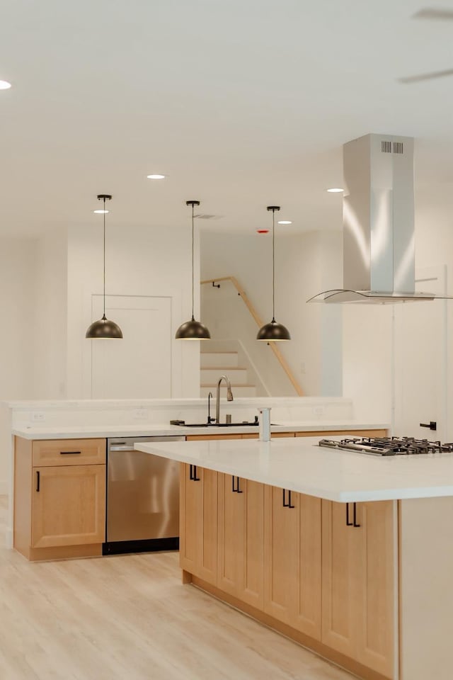 2711 Delano St, Houston, TX 77004 - kitchen featuring island exhaust hood, stainless steel appliances, light brown cabinets, a sink, and light wood-style floors