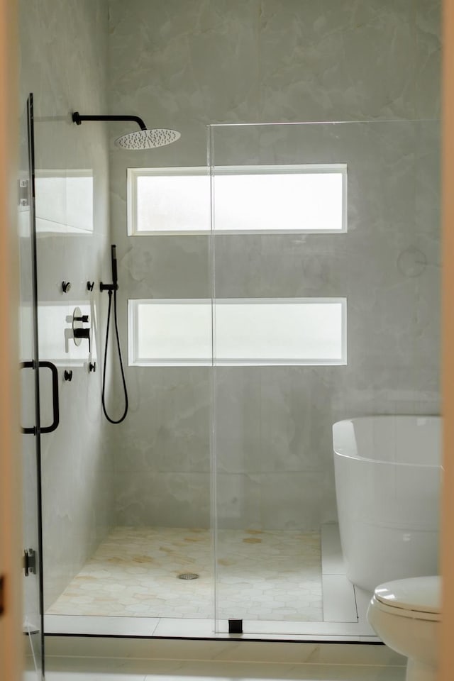 2711 Delano St, Houston, TX 77004 - bathroom with a stall shower, toilet, and tile patterned floors