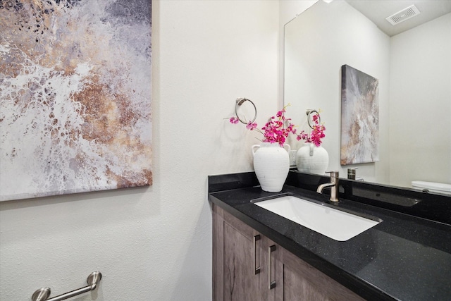 bathroom featuring visible vents and vanity
